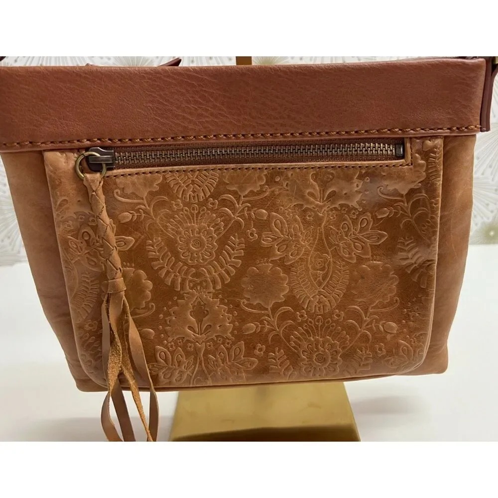 The Sak matte floral embossed tan leather Sanibel crossbody bag